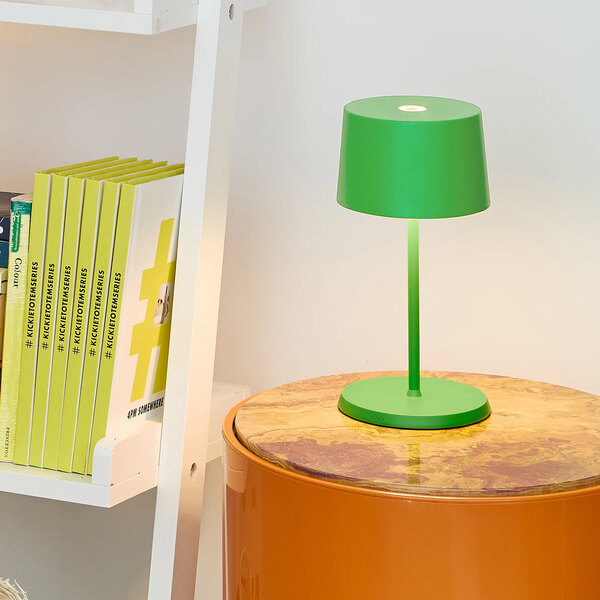 A small, apple green cordless rechargeable table lamp with a simple modern design.