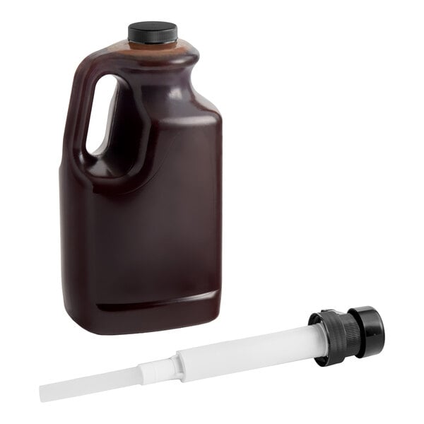 A large plastic jug of chocolate sauce with a separate white dispensing pump.