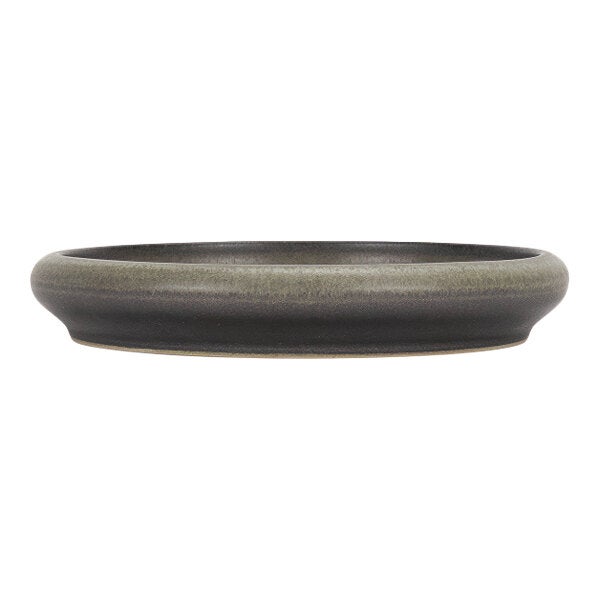 A round green and brown stoneware plate with a low rim.