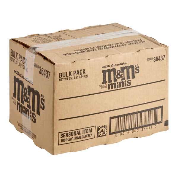 A large cardboard box labeled 'm&m's minis' with shipping and product information printed on the sides, sealed with clear tape.