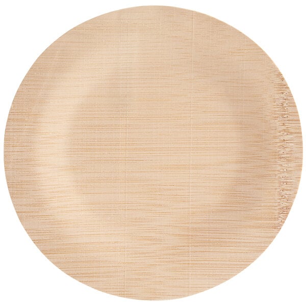 A round, light-colored plate with a natural wood-like texture and subtle grain patterns.