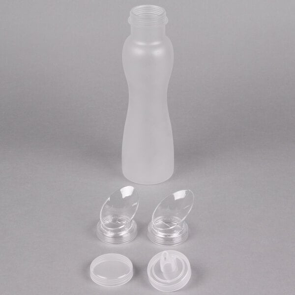 A frosted polycarbonate bottle with multiple clear plastic lids designed for salad dressing or juice.