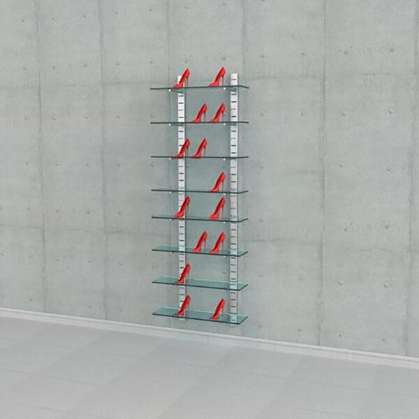 A vertical wall-mounted retail display with eight glass shelves, each holding a pair of red high-heeled shoes.