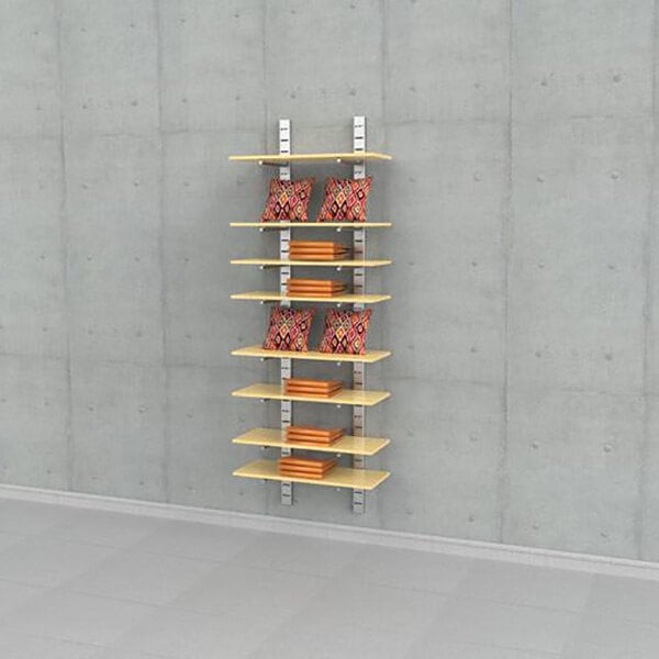 A vertical wall-mounted retail display unit with eight wooden shelves supported by metal brackets, holding pillows and folded items.