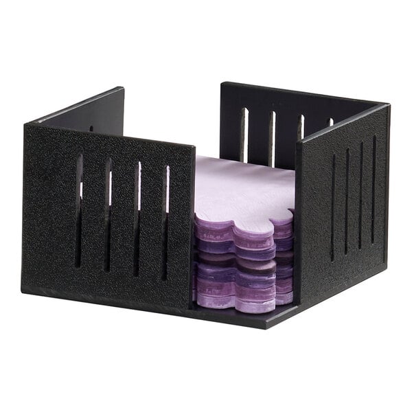 A black napkin organizer holding a stack of purple 5x5 napkins.