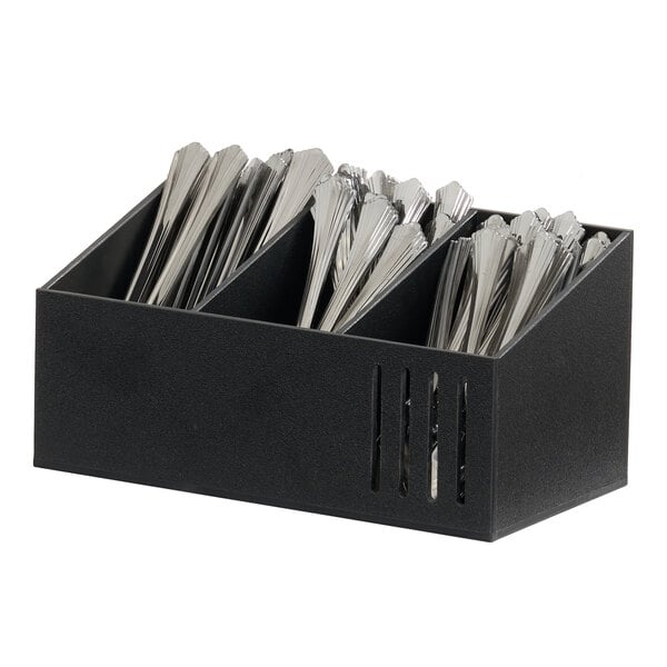 A black flatware organizer holding separated sets of silverware.
