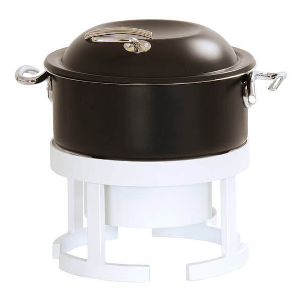 A black metal chafer with a lid and white metal stand.