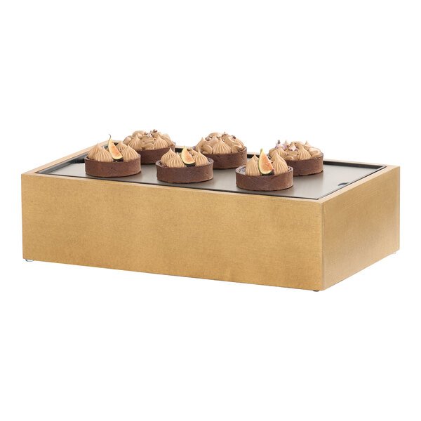 A rectangular rustic pine wood cold housing frame with a cold concept base, displaying several small desserts on top.