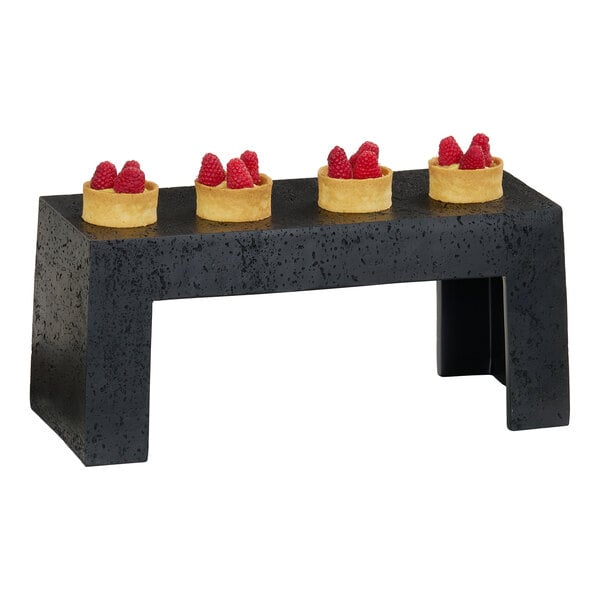 A black resin riser measuring 15x11x7 inches, used for displaying items.