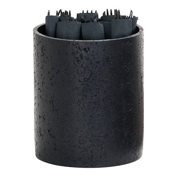 A black cylindrical resin riser with a textured surface, holding rolled black napkins and utensils.