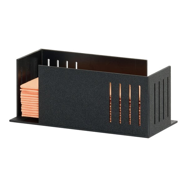 A black rectangular napkin organizer holding a stack of orange napkins.