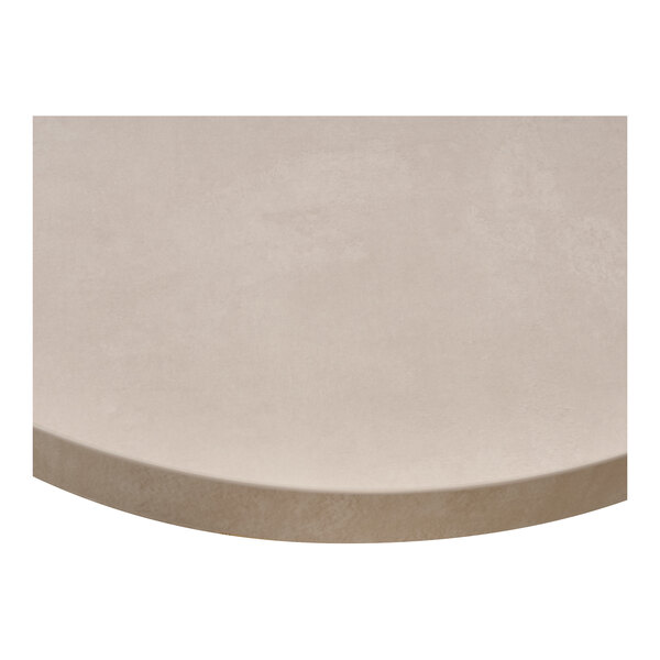 A round sandstone-colored laminate indoor table top.