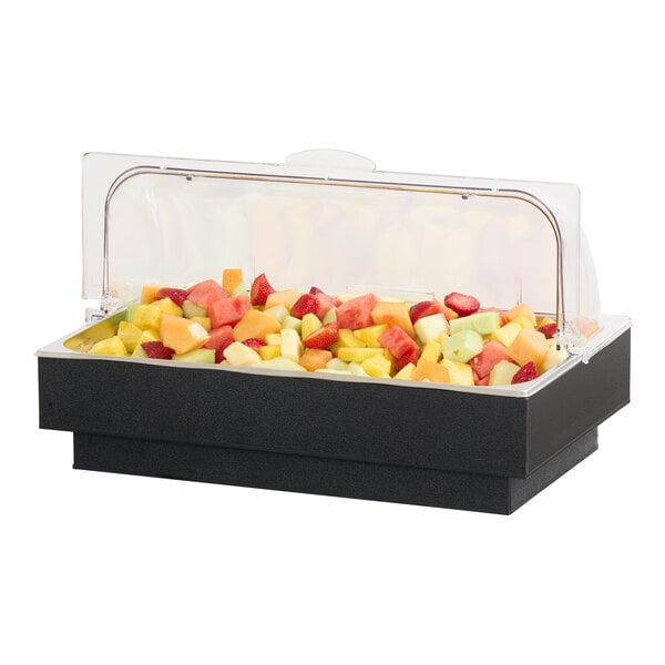 A classic cold food pan with a clear cover, filled with assorted cut fruit.