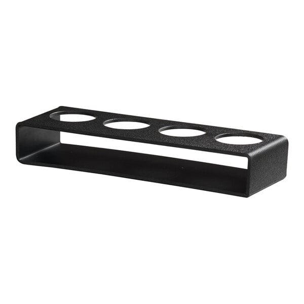 A black rectangular metal caddy with four circular cutouts on the top, designed to hold tasting glasses.
