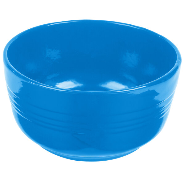 A Tablecraft sky blue cast aluminum fruit bowl with a handle.