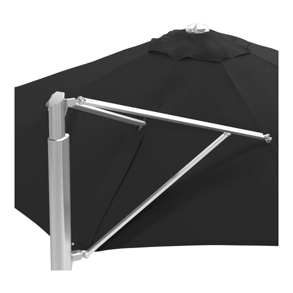 A large black round cantilever umbrella with a silver aluminum base and frame.