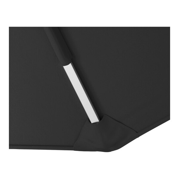 A close-up of a black cantilever umbrella with a silver aluminum support pole and fabric canopy.
