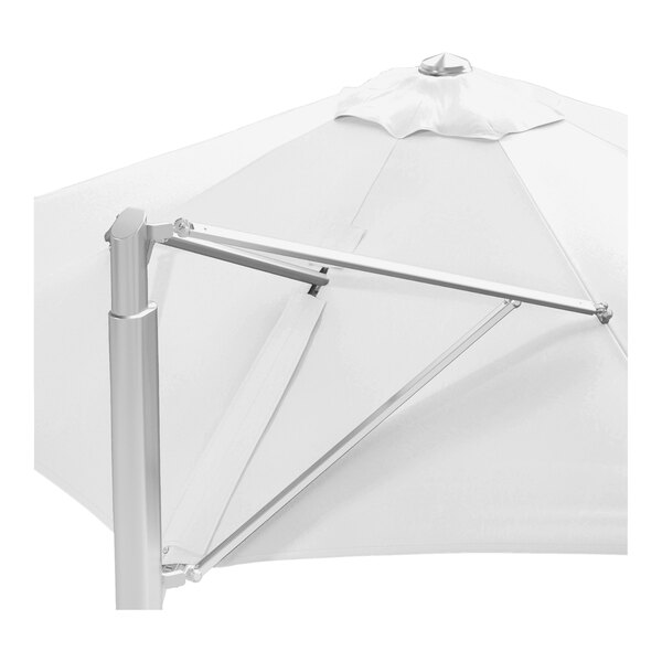 A large white round cantilever umbrella with a silver aluminum base and a Sunbrella awning-grade canopy.