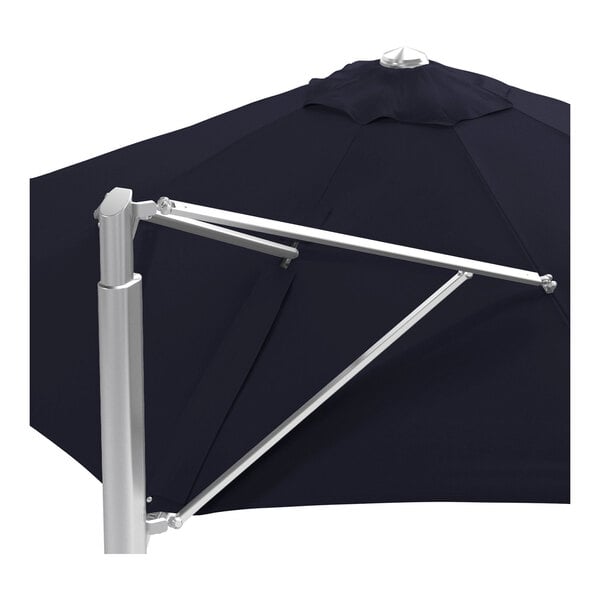 A navy blue round cantilever umbrella with a silver aluminum base and frame.