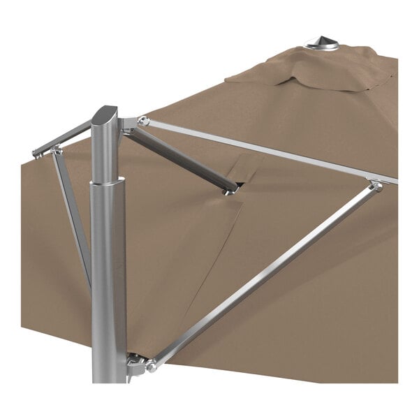A taupe square cantilever umbrella with a silver aluminum base and a Sunbrella awning-grade canopy.