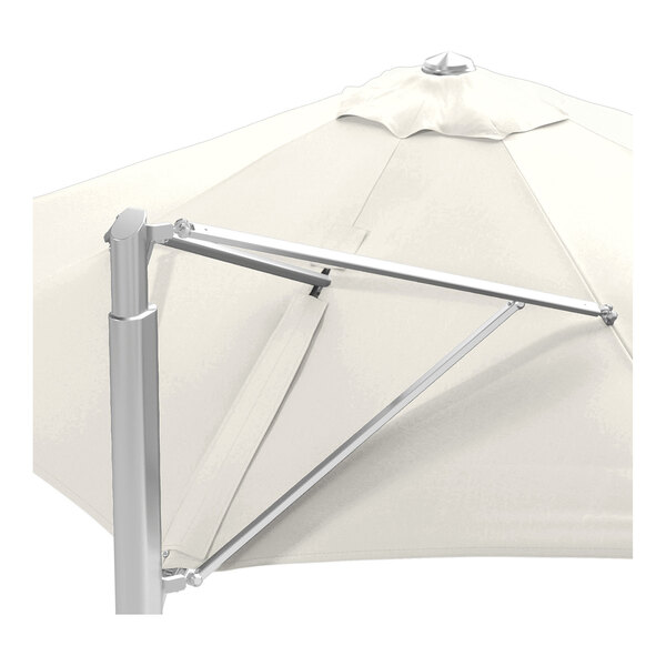 A large round cantilever umbrella with a natural-colored canopy and a silver aluminum base.