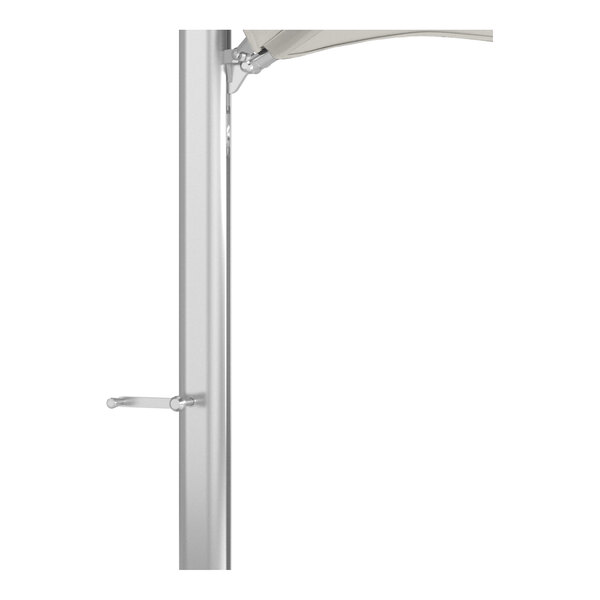 A silver aluminum pole and base of a cantilever umbrella with a natural-colored canopy.