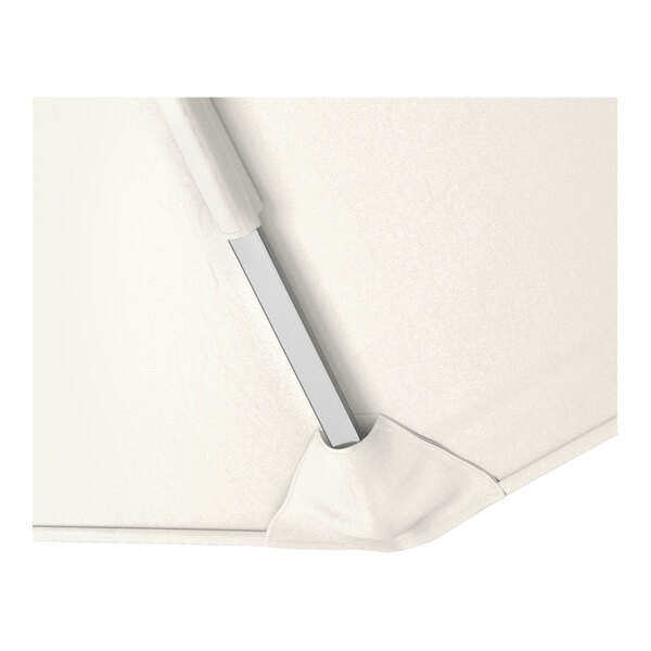 A close-up of a natural-colored cantilever umbrella canopy with a silver aluminum support rib.