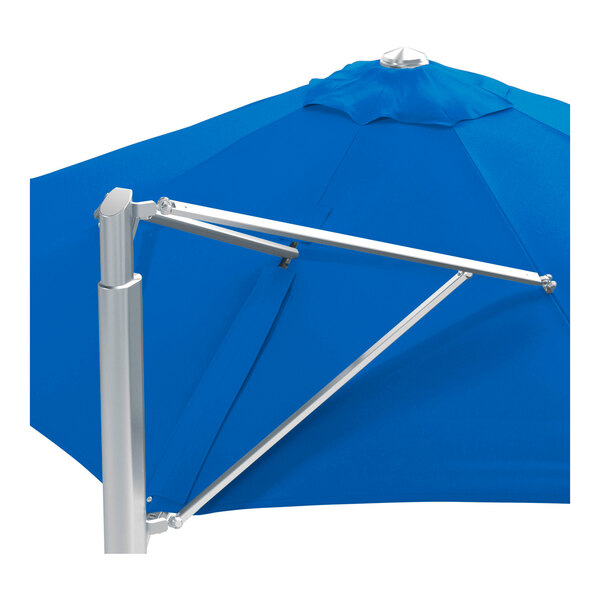 A large round cantilever umbrella with a pacific blue canopy and a silver aluminum base.
