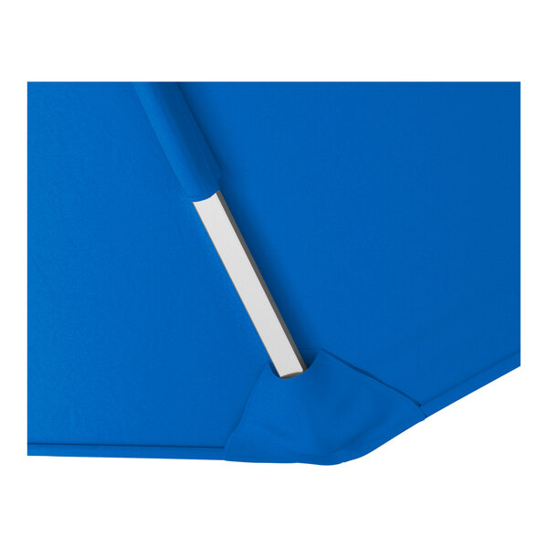 A close-up of a blue cantilever umbrella canopy with a silver aluminum support rib.