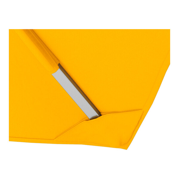 A close-up of a sunflower yellow square cantilever umbrella with a silver aluminum base and Sunbrella awning-grade canopy.