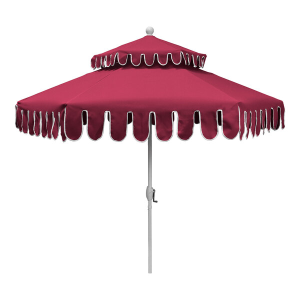 A hot pink round two-tier patio umbrella with a white aluminum pole and decorative scalloped edges.