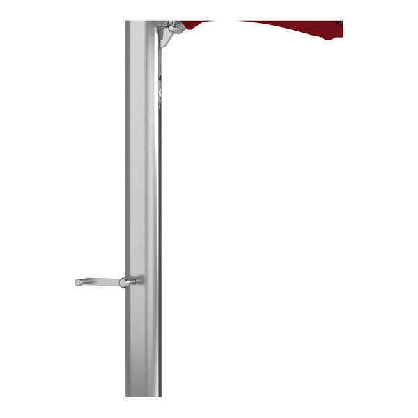 A silver aluminum cantilever umbrella pole with a red Sunbrella canopy partially visible at the top.