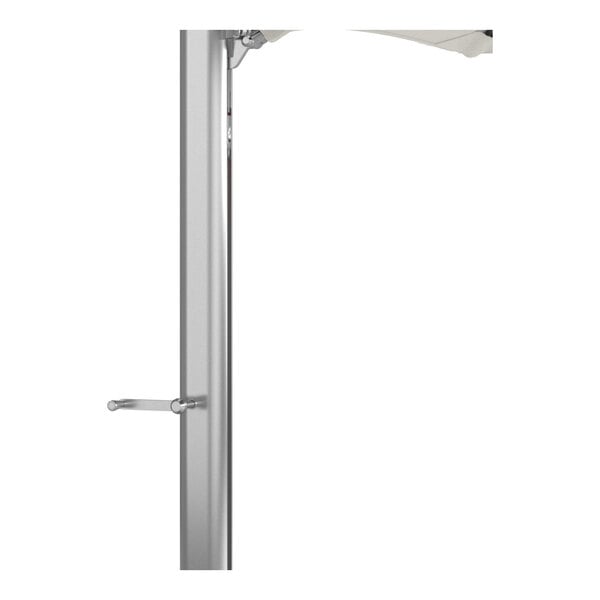 A silver aluminum cantilever umbrella pole with a crank handle and a partial view of a natural-colored canopy.
