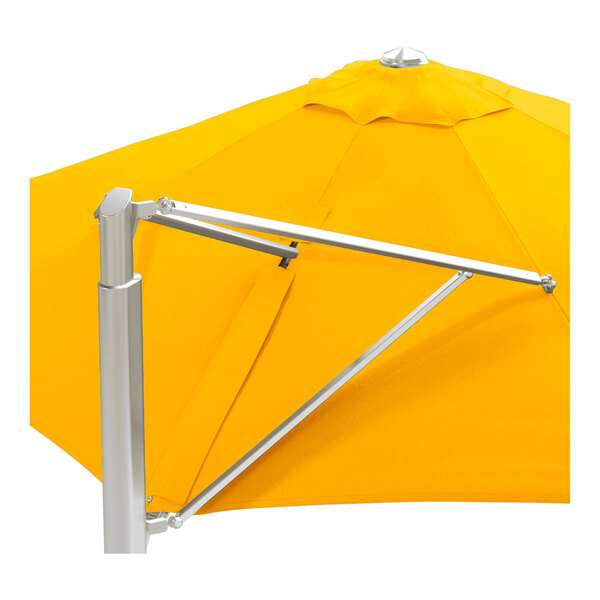 A large round cantilever umbrella with a sunflower yellow canopy and a silver aluminum base.