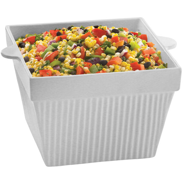 A Tablecraft natural cast aluminum square bowl filled with corn salad.