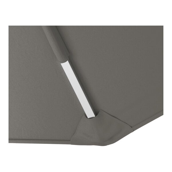 A close-up view of a charcoal gray cantilever umbrella with a silver aluminum support and fabric canopy.