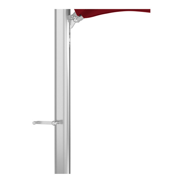 A silver aluminum cantilever umbrella base with a jockey red Sunbrella awning-grade canopy.