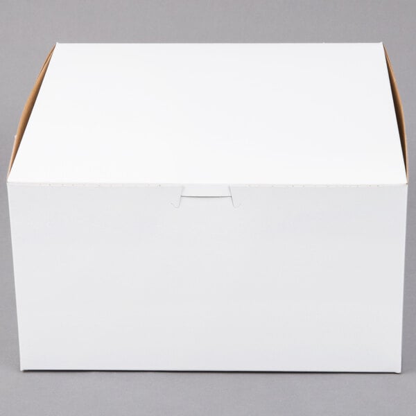 A plain white cardboard bakery box with a closed lid.