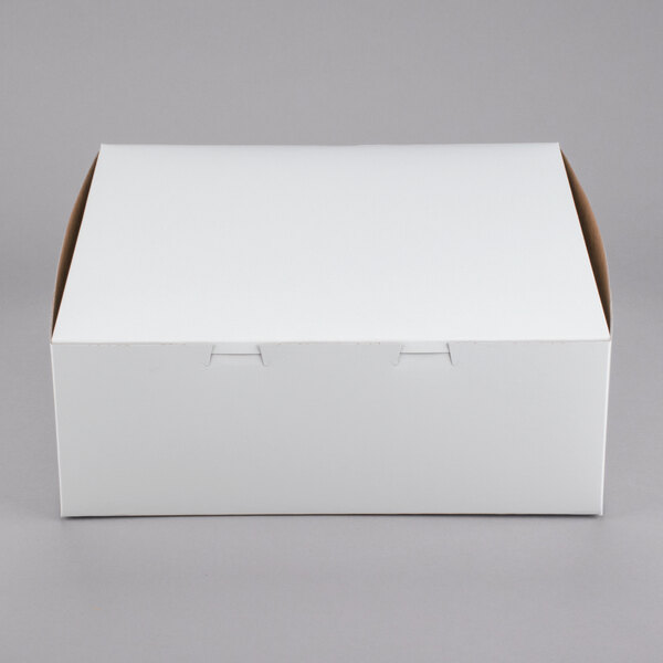 A plain white cardboard bakery box with a closed lid.