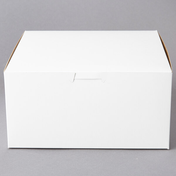 A plain white bakery box with a closed lid, measuring 8 inches by 8 inches by 4 inches.