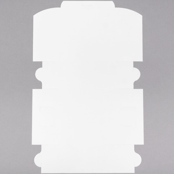 A flat, unfolded white cardboard bakery box for cakes or pastries.