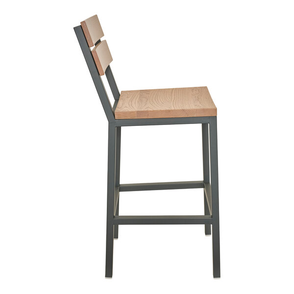 A bar stool with a powder-coated steel frame and natural oak seat and slat back.