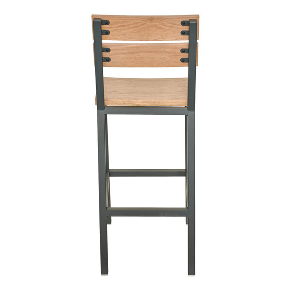 A bar stool with a powder-coated steel frame and natural oak slat back and seat.
