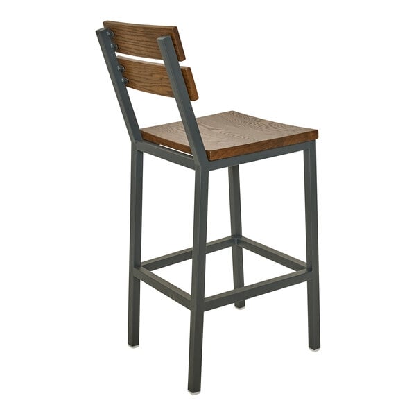 A bar stool with a powder-coated steel frame and warm oak seat and slat back.