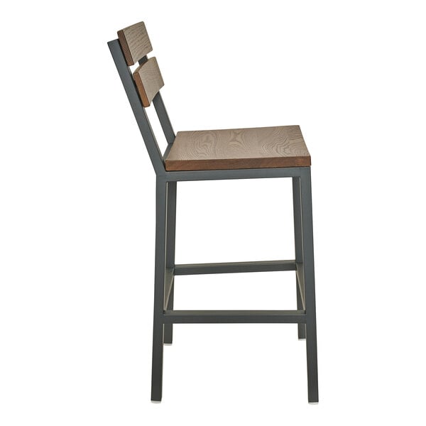 A bar stool with a powder-coated steel frame and warm oak slat back and seat.