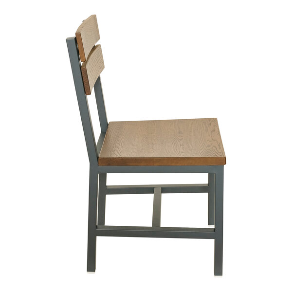 A powder-coated steel chair with a slat back and warm oak seat and back panels.
