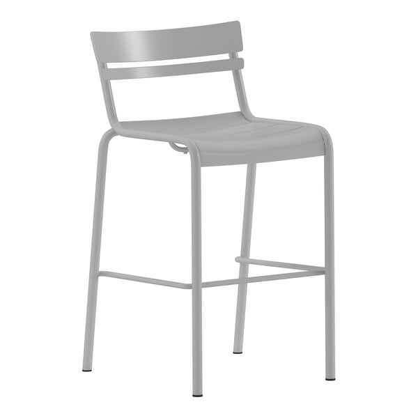 A silver steel stackable bar stool with a slat back design suitable for indoor or outdoor use.