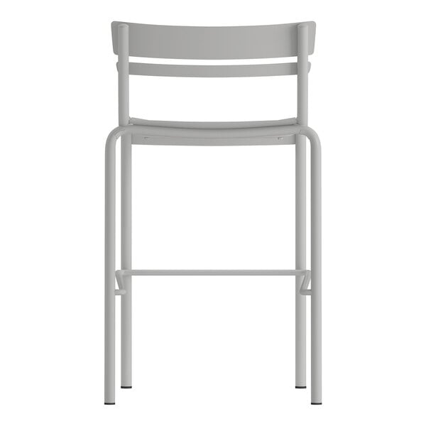 A silver steel stackable bar stool with a slat back design suitable for indoor or outdoor use.