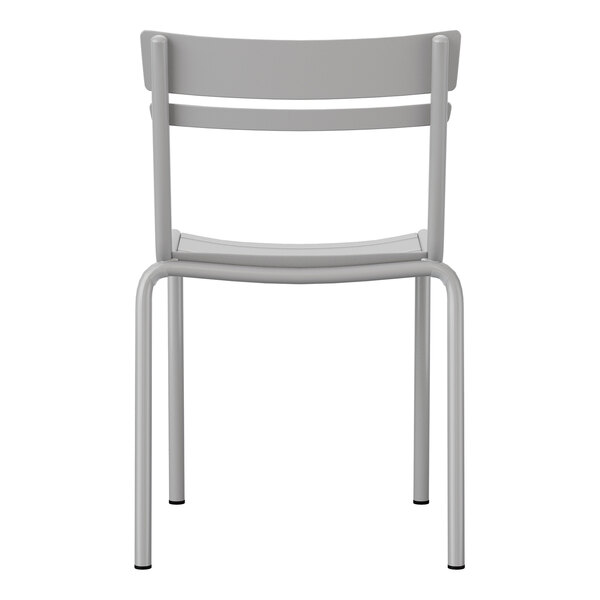 A silver steel stackable side chair with a slat back design suitable for indoor or outdoor use.