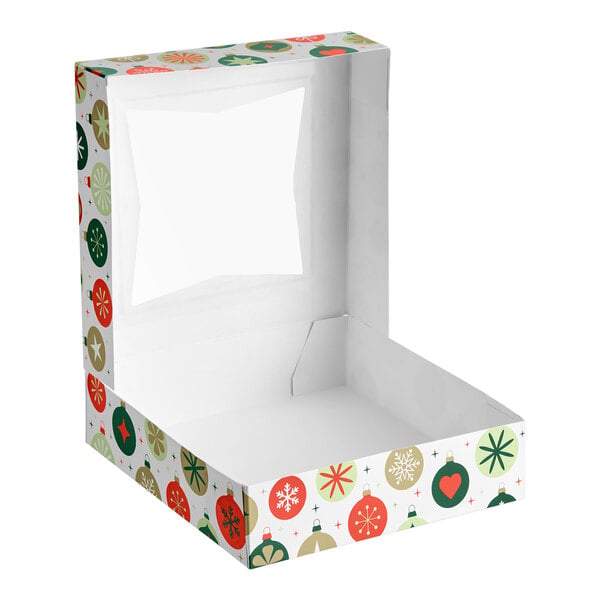 A festive, ornament-patterned bakery box with a clear window on the lid, shown open and empty.